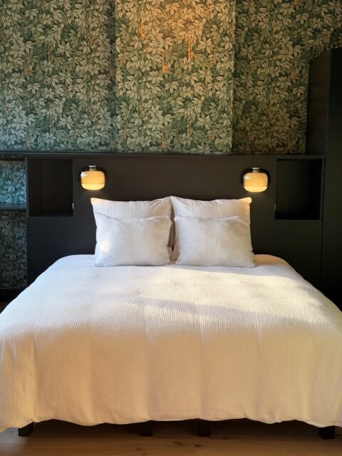 Luxury king size bed and botanical wallpaper in boutique BB Ghent